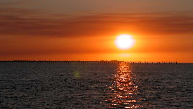 The crystal clear azure waters of Hervey Bay, pink majestic Queensland Skies, and a cold glass of bubbles in your hand - it doesn't get much better than this!