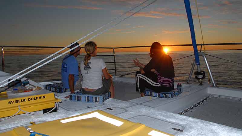 The crystal clear azure waters of Hervey Bay, pink majestic Queensland Skies, and a cold glass of bubbles in your hand - it doesn't get much better than this!