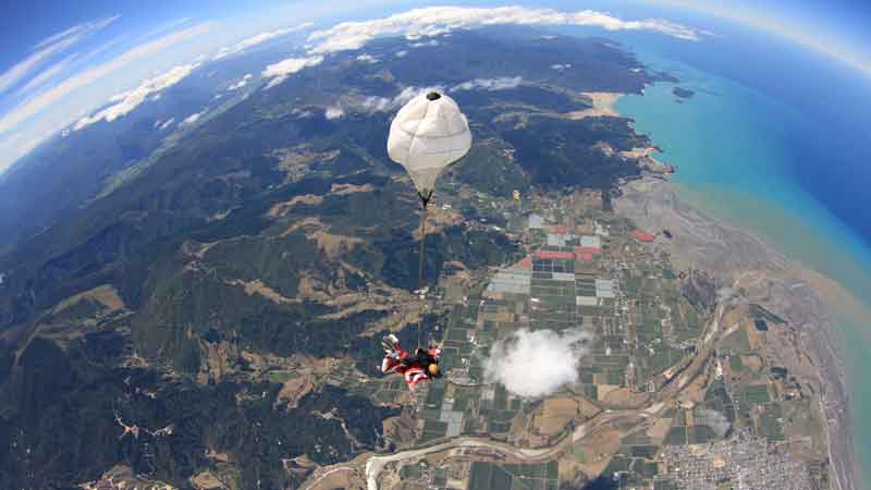 Enjoy a panoramic flight with stunning views as you climb to 16,500ft over snow-capped mountains, golden beaches and turquoise oceans then...JUMP! 