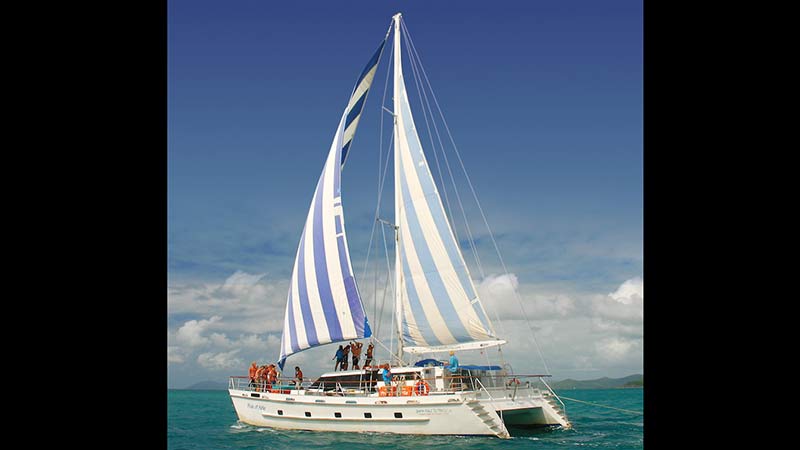 Deluxe Catamaran Sailing Adventure with resort accommodation on South Molle Island. Explore the Whitsundays!