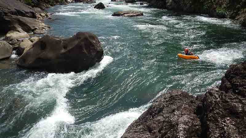 River board the Tully River on up to grade 3 rapids at face level!