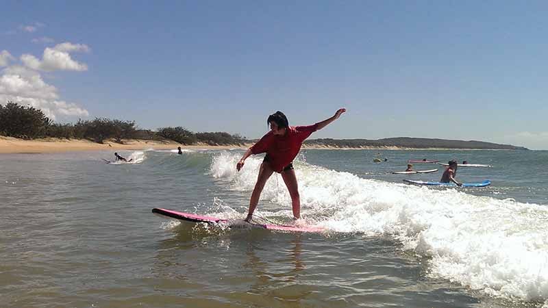 Learn to surf on Queensland's pristine northern most surf beach!