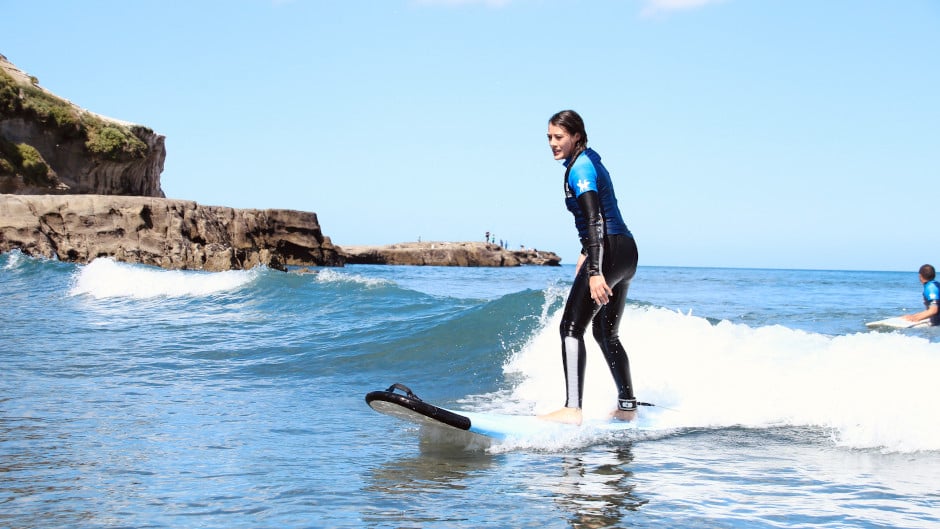 The 100% kiwi owned and operated Muriwai Surf School is located just a 1 minute walk from the beach and surfing action. Our 2 hour lessons are delivered by surf life guards, highly qualified coaches and some of the very best skilled surfers in the region.