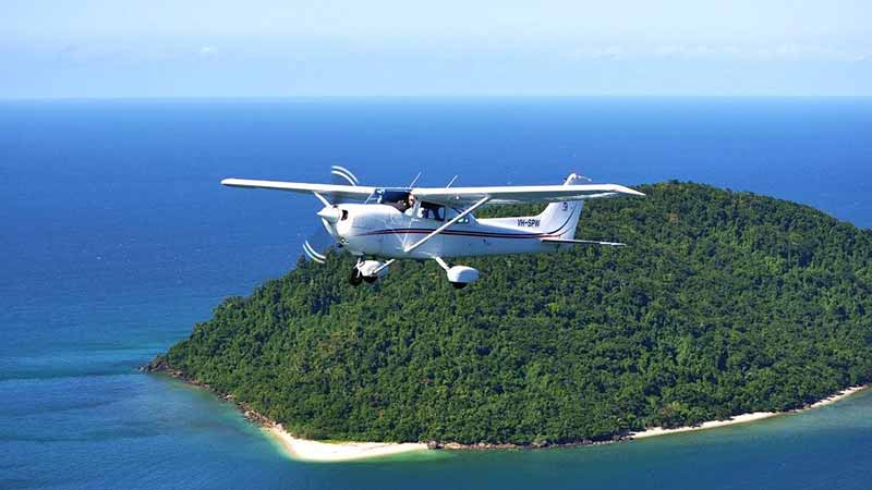 Take a 30 minute fixed wing scenic flight over the rainforest and Great Barrier Reef from Cairns