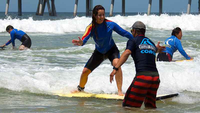 The Cheyne Horan School of Surf is your go-to for epic surf experience. The foundations of getting the basics right first will see you getting to your feet before you know it. Your first lesson will be in waist deep water with easy to ride waves and a soft board, helping you learn faster and catch more waves. You’ll be supported by qualified instructors and surf lifesavers.