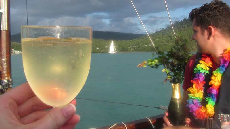 Join us for an unforgettable unique sunset over Airlie Beach in the only Hawaiian sailing outrigger canoe in Australia