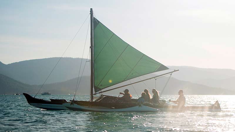 Join us for an unforgettable unique sunset over Airlie Beach in the only Hawaiian sailing outrigger canoe in Australia