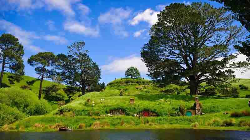 Take a journey deep into the heart of the North Island with a captivating guided tour to some of the best tourist attractions in New Zealand - The Hobbiton Movie Set & Ruakuri Caves!
