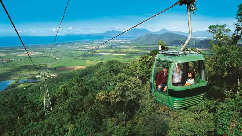 Visit Kuranda village via Kuranda Scenic Railway and  Kuranda Skyrail Cableway from Cairns