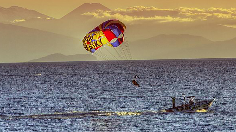 Experience the thrill of soaring to new heights with Taupo Parasail, where you can live in the excitement and take in the stunning scenery while gracefully gliding above the waters of Lake Taupo.