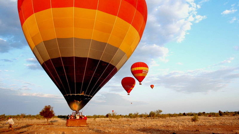 Experience the breathtaking Hot Air Ballooning experience, floating silently above Australia's iconic Northern Territory!